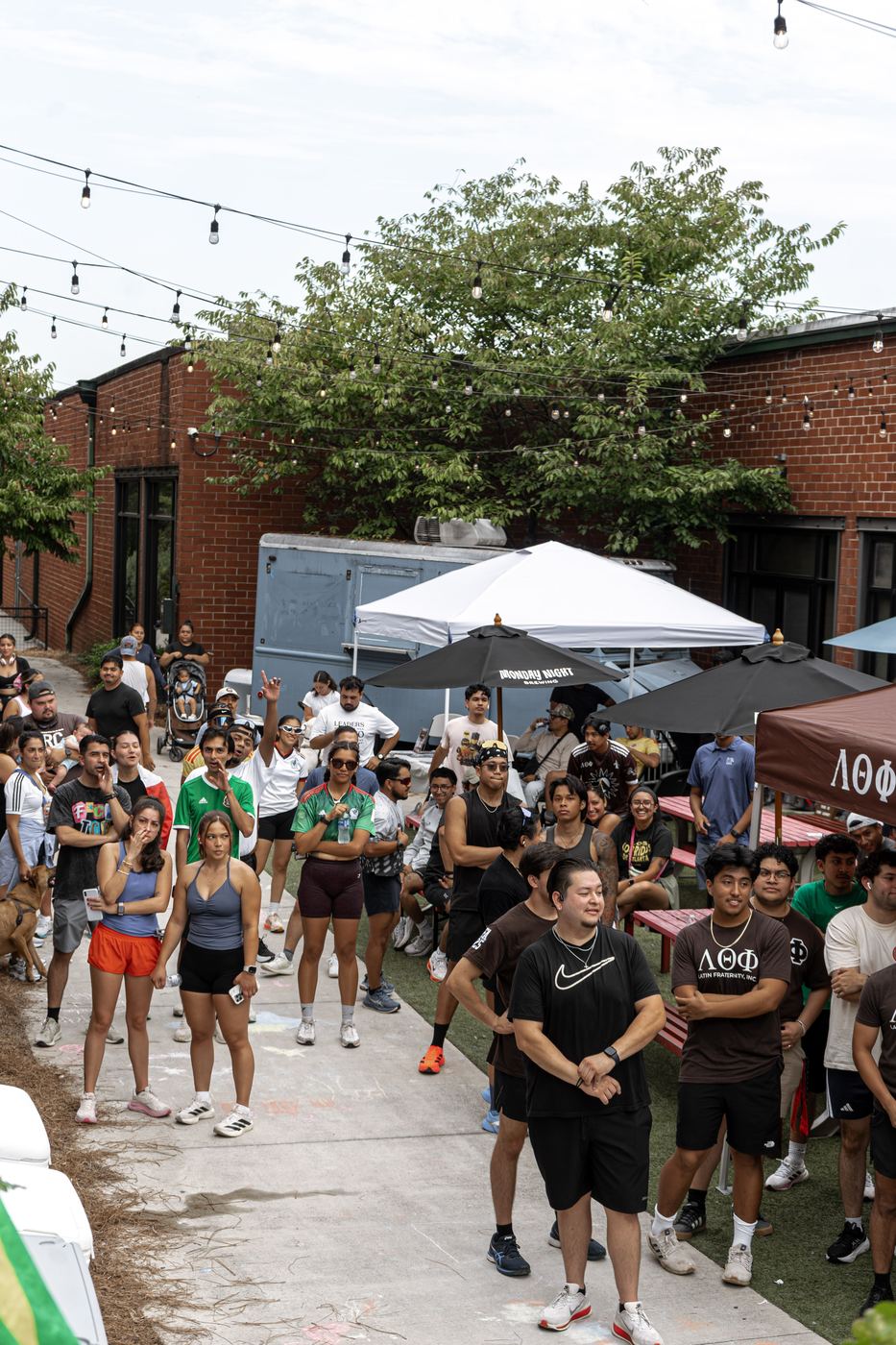 The crowd standing in the courtyard listening to the morning's remarks before the run.